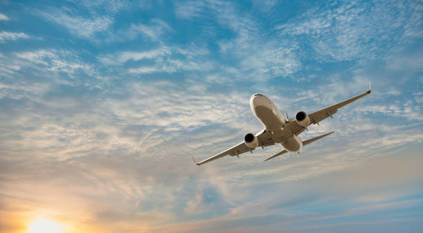 airplane flying over tropical sea at sunset antalya, turkey